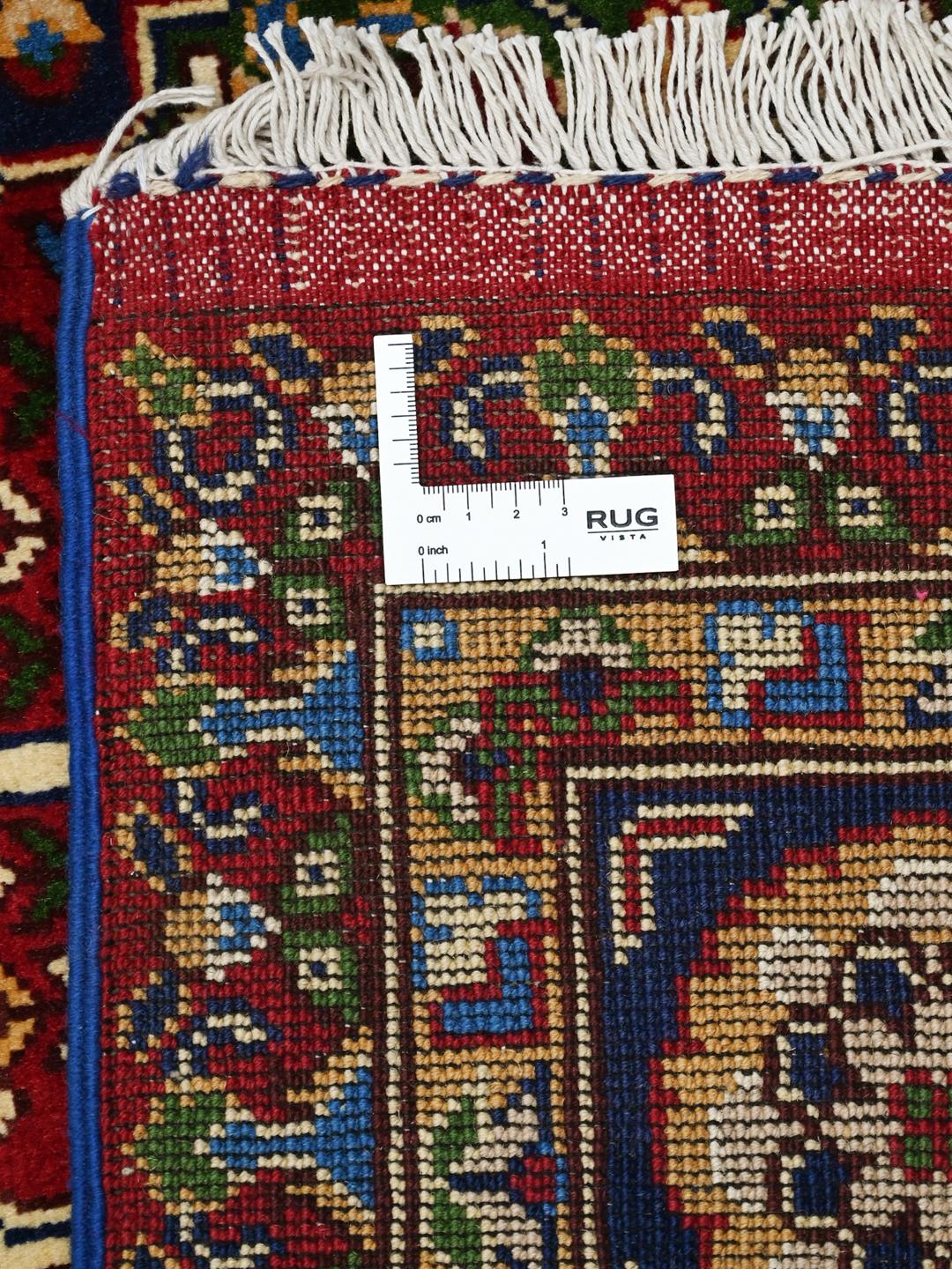 Hand-knotted Middle Eastern Kunduz rug with multicolor geometric patterns.