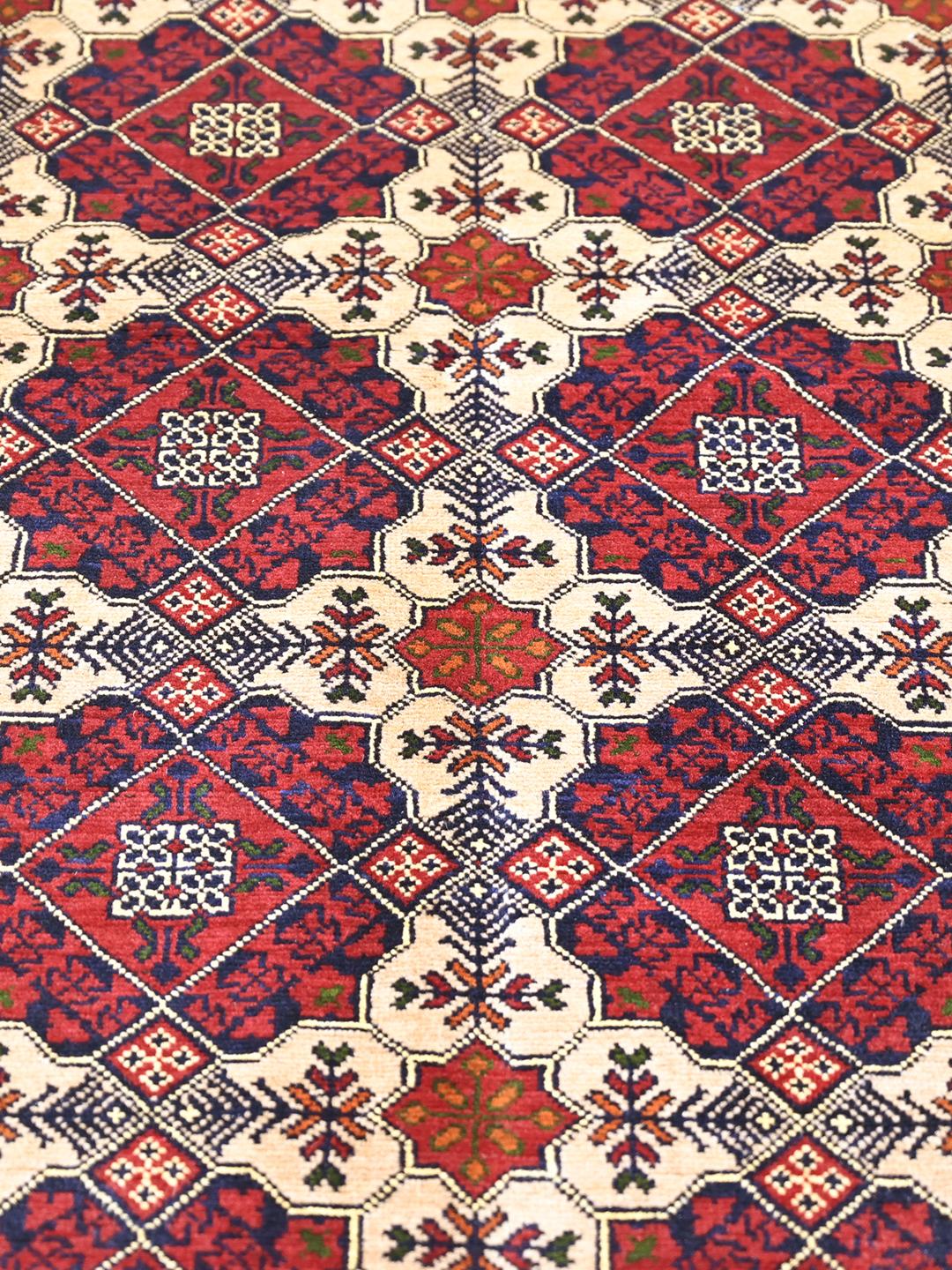 Handmade Afghan Kunduz rug in dark red
