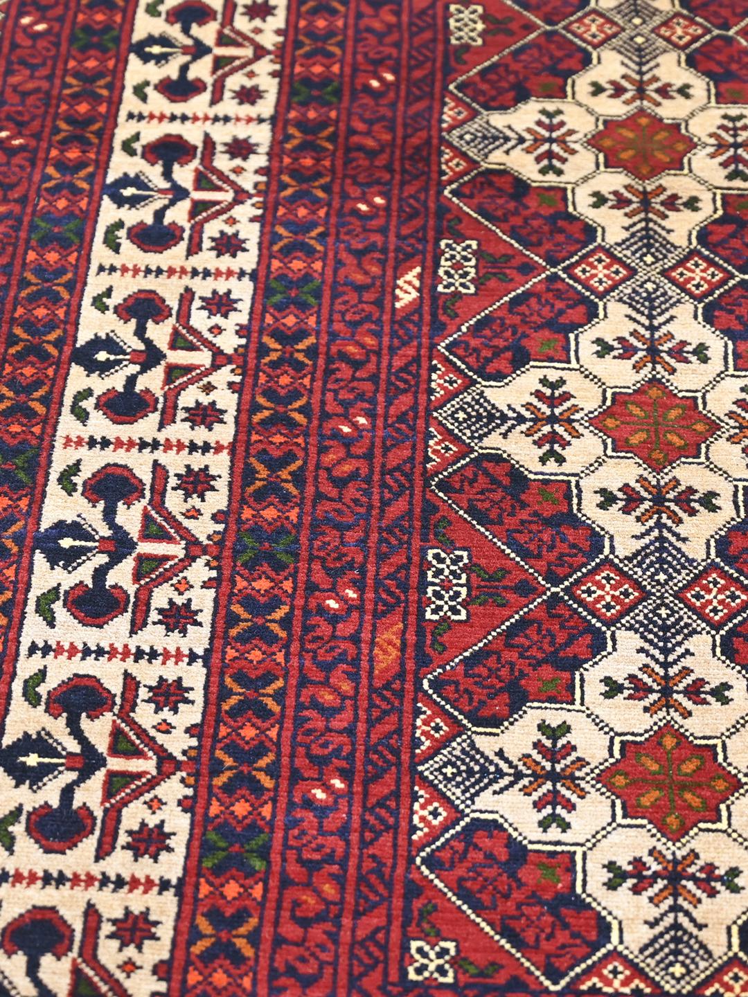 Handmade Afghan Kunduz rug in dark red