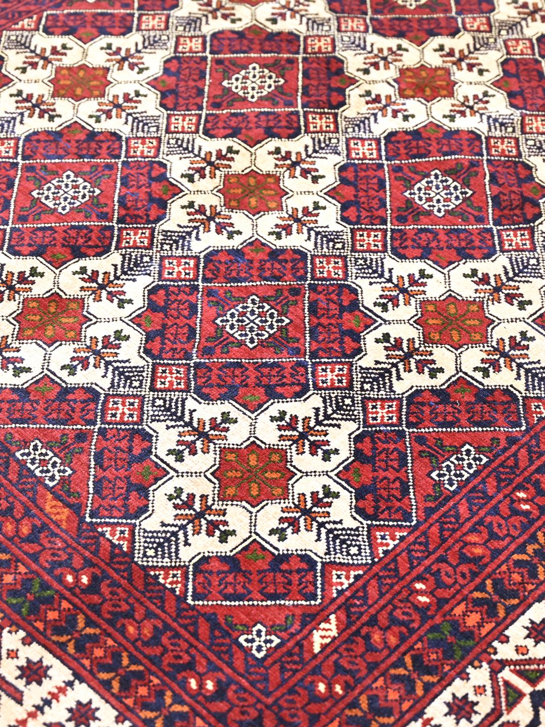 Handmade Afghan Kunduz rug in dark red