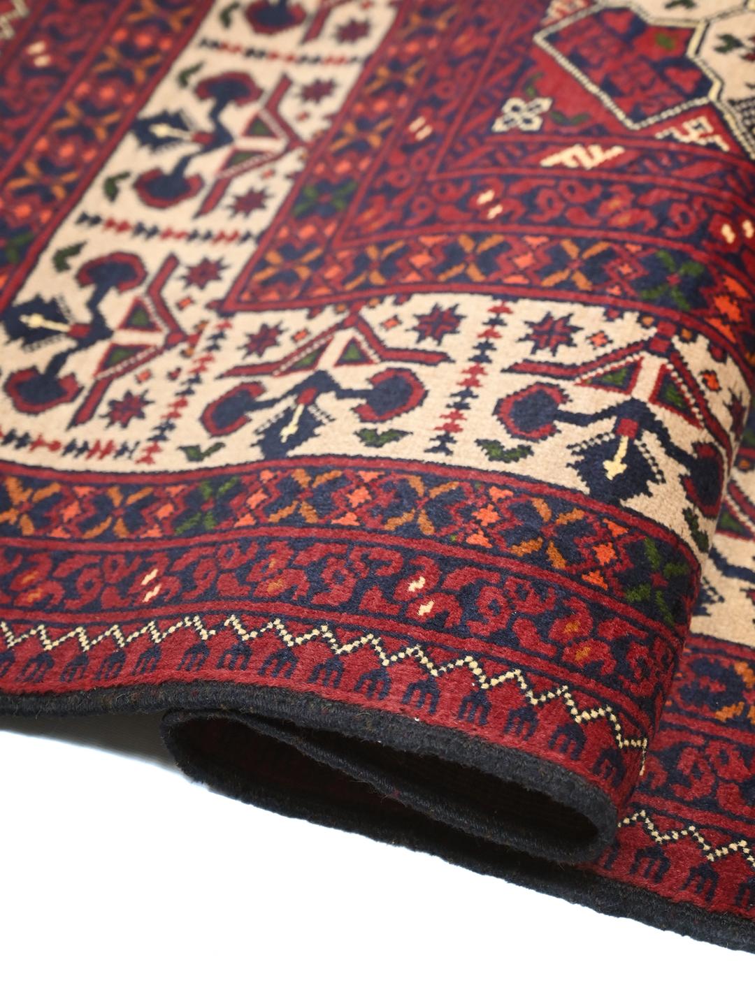 Handmade Afghan Kunduz rug in dark red