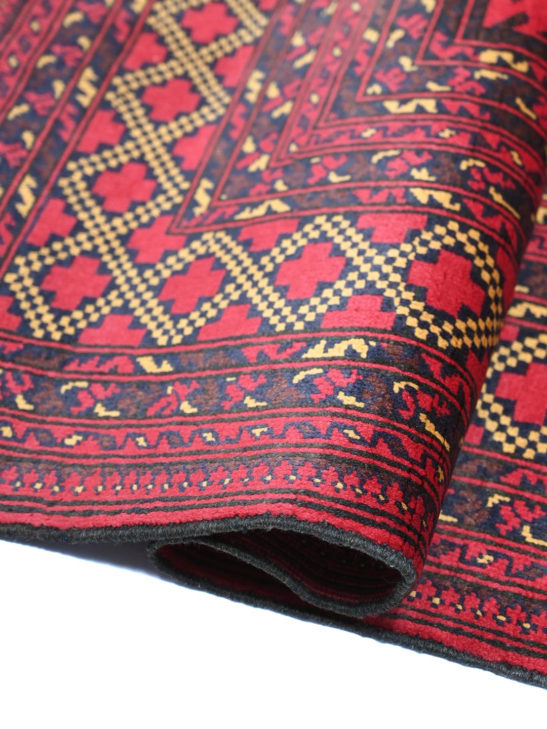 Hand-knotted Middle Eastern Kunduz rug in deep red and black tones