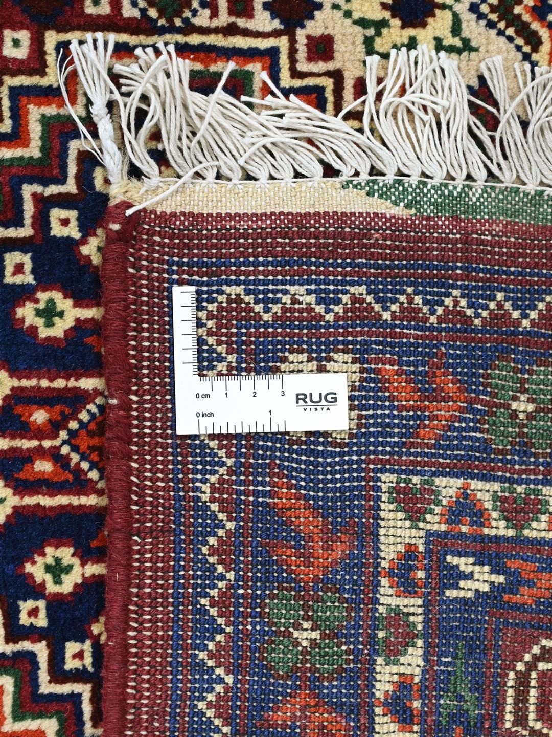 Hand-knotted red Afghan Kunduz rug with geometric patterns