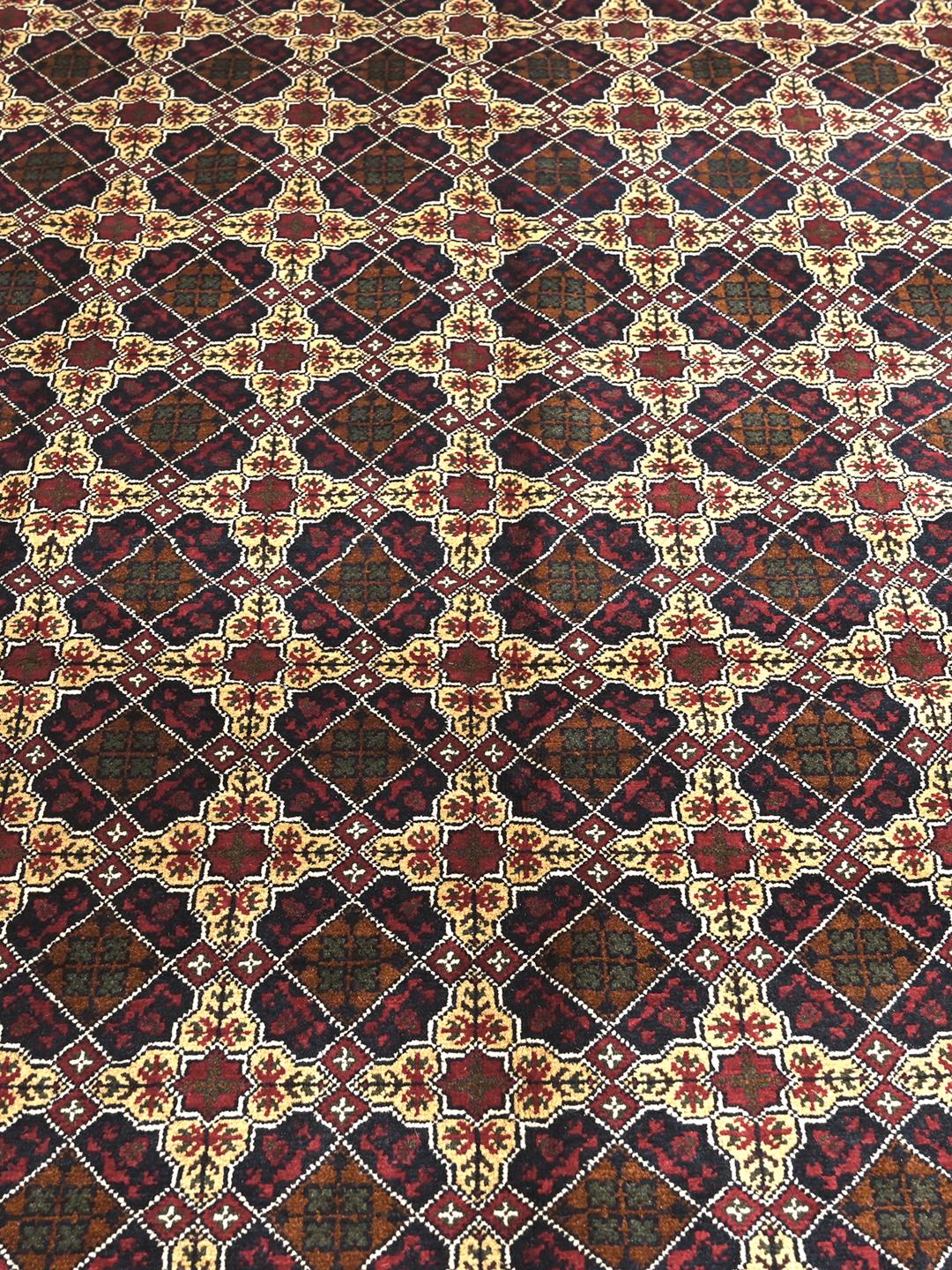 Hand-knotted Kunduz rug from the Middle East with a dark-red and beige geometric pattern.