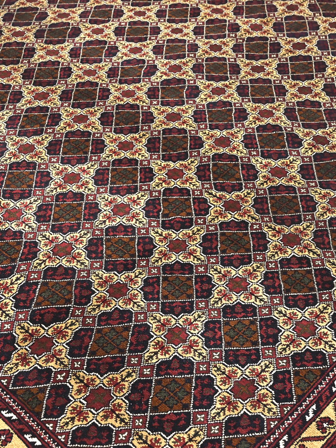 Hand-knotted Kunduz rug from the Middle East with a dark-red and beige geometric pattern.