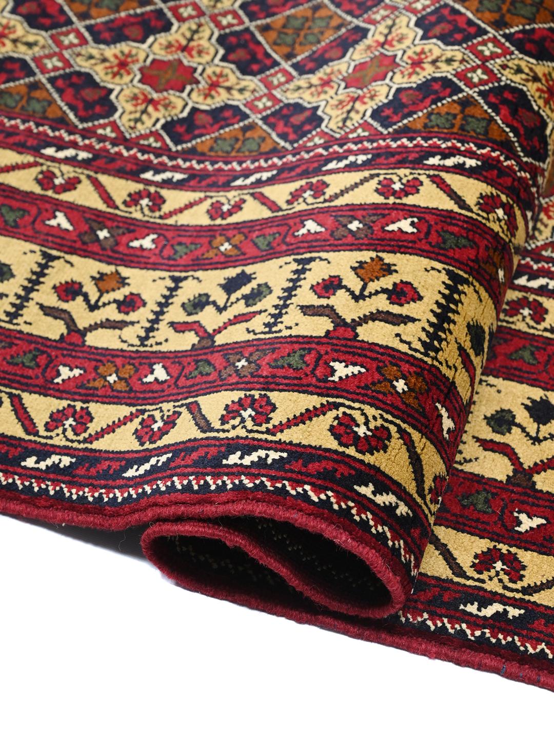 Hand-knotted Kunduz rug from the Middle East with a dark-red and beige geometric pattern.