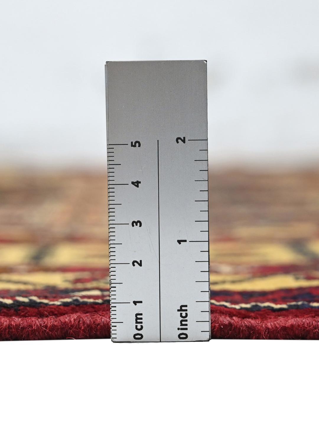Hand-knotted Kunduz rug from the Middle East with a dark-red and beige geometric pattern.