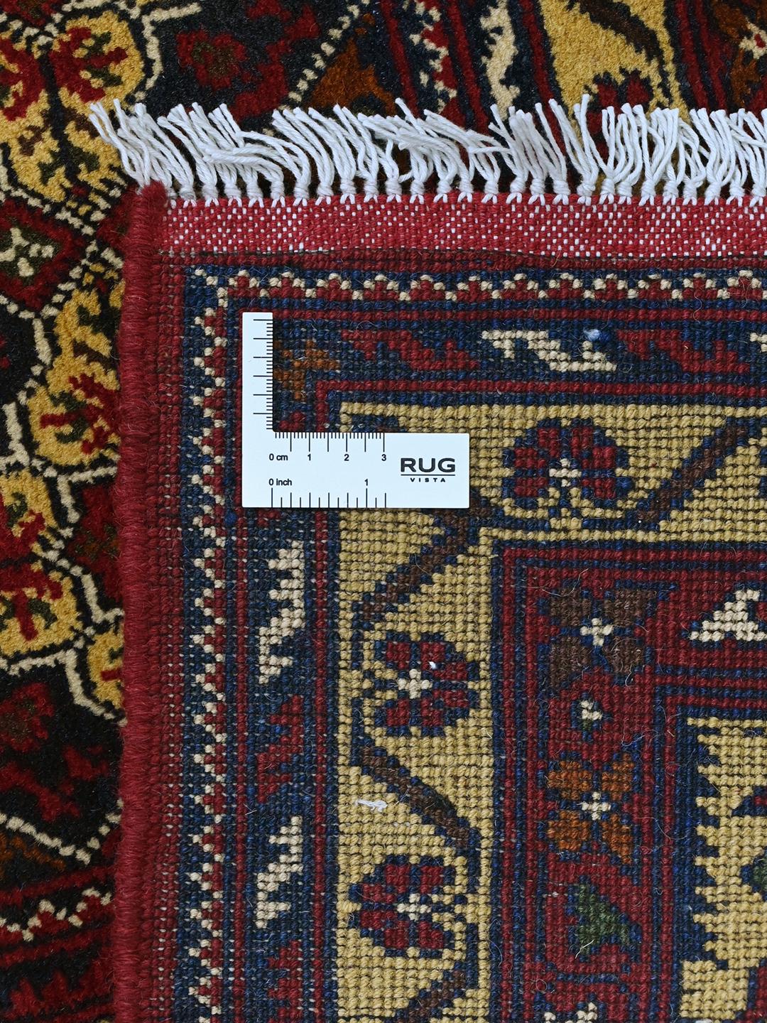 Hand-knotted Kunduz rug from the Middle East with a dark-red and beige geometric pattern.