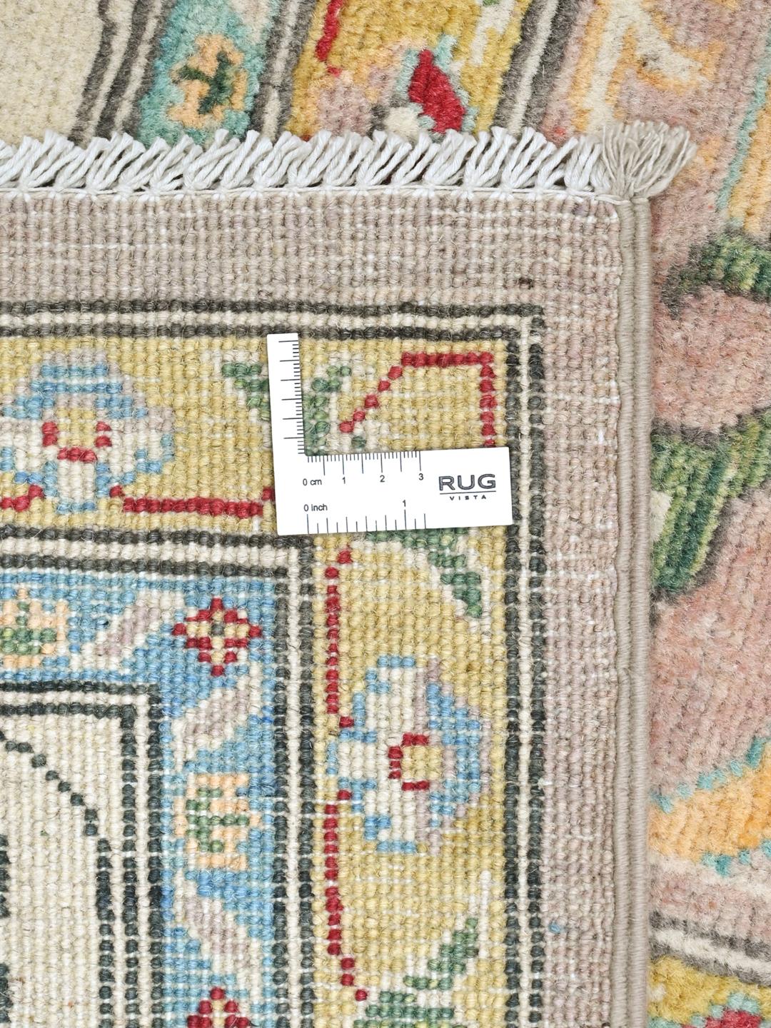 Tapis en laine noué main d'Afghanistan en rose clair et crème avec des détails floraux