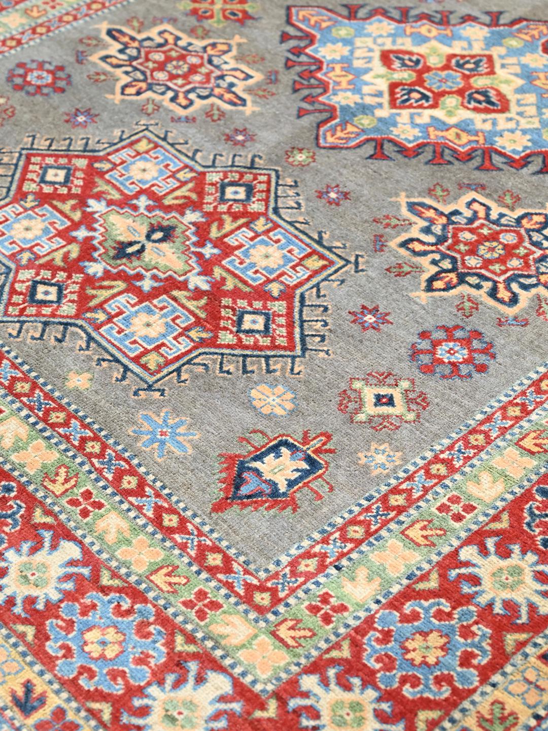 Hand-knotted Kazak Fine wool rug in grey and red from Afghanistan