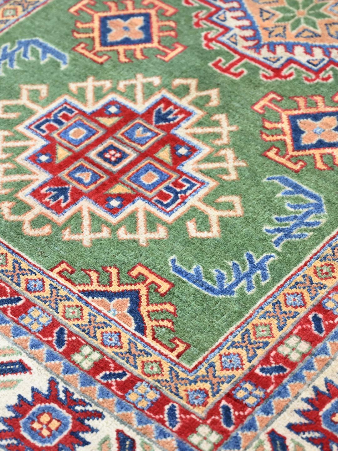 Hand-knotted Kazak Fine rug from Afghanistan in green and multicolor