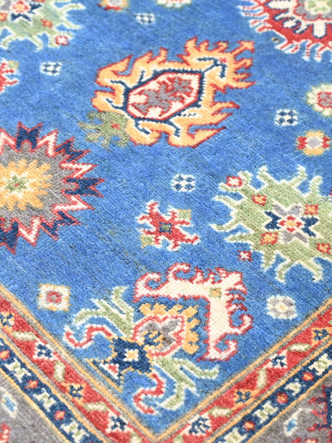 Covor Kazak Fine înnodat manual din Afganistan în nuanțe de albastru și roșu