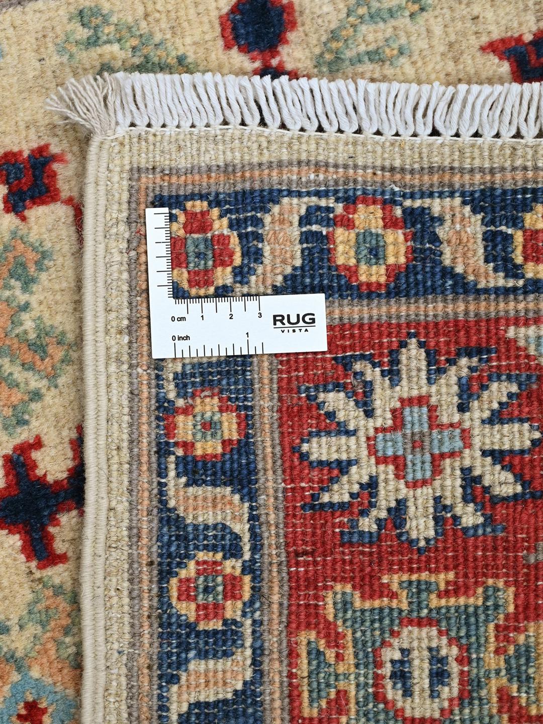 Hand-knotted Afghan Kazak Fine rug in red and blue featuring traditional tribal medallions
