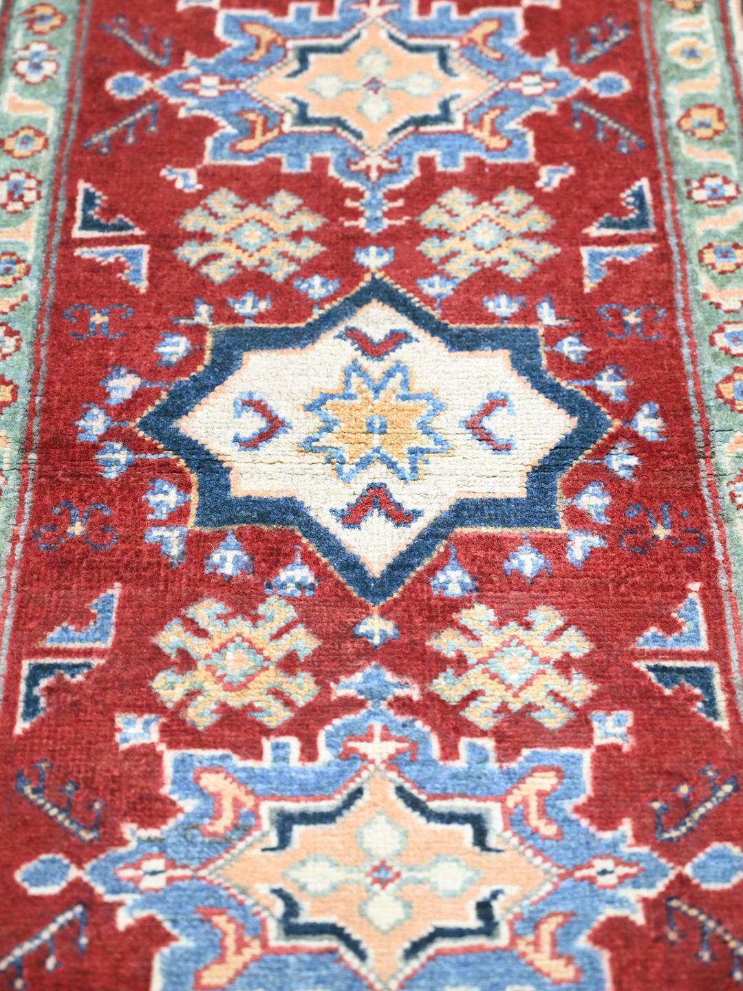 Hand-knotted Kazak Fine wool rug in red and blue from Afghanistan