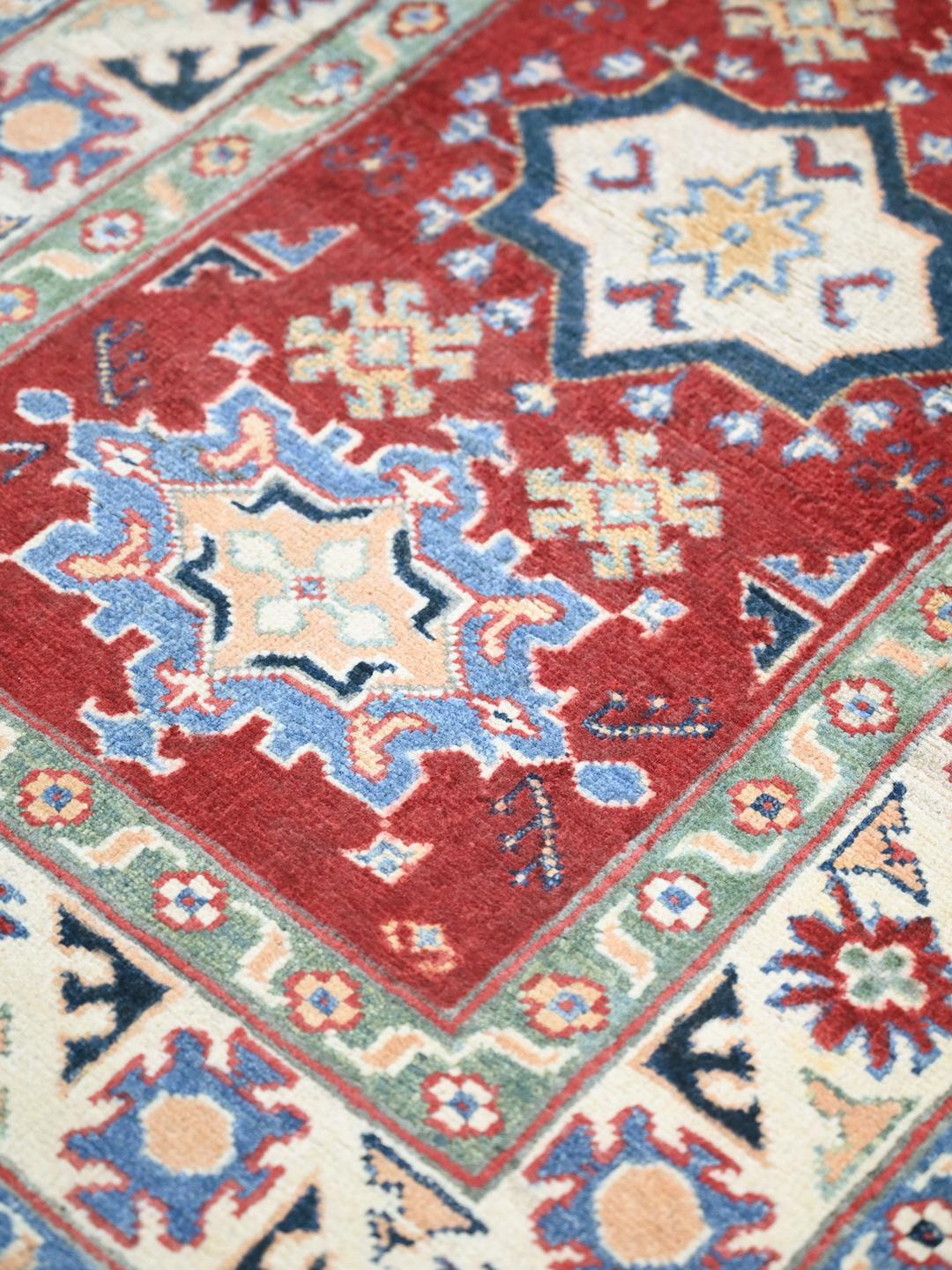 Hand-knotted Kazak Fine wool rug in red and blue from Afghanistan