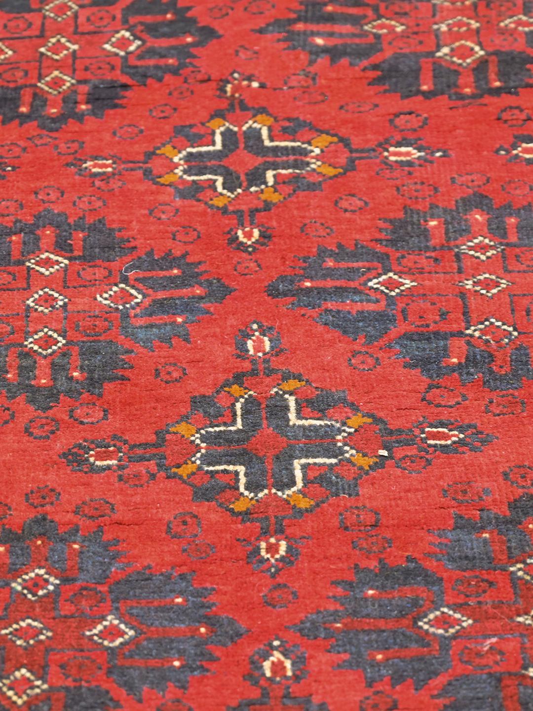 Hand-knotted Afghan Khal Mohammadi rug in red and dark-blue