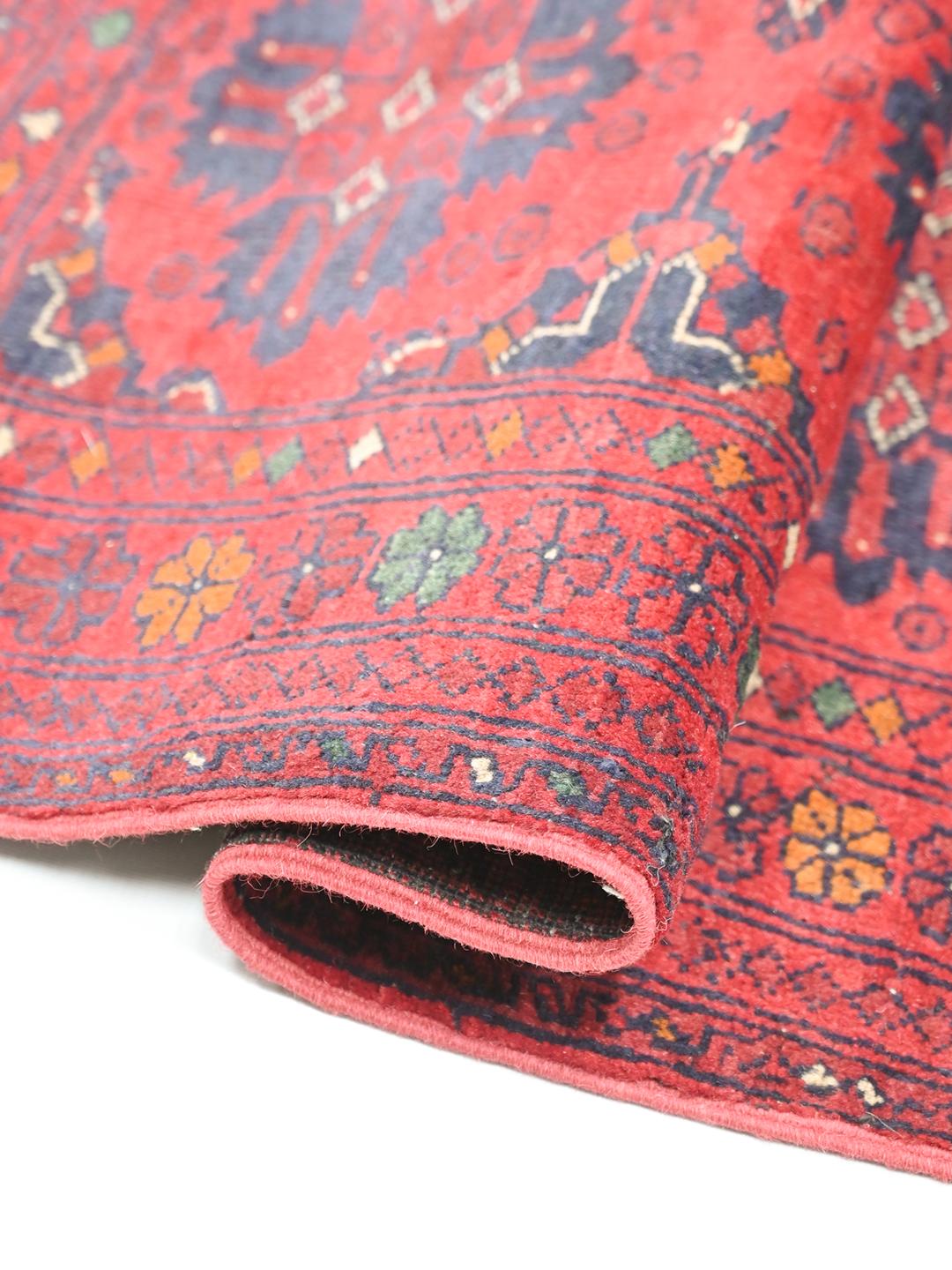 Hand-knotted Afghan Khal Mohammadi rug in red and dark-blue