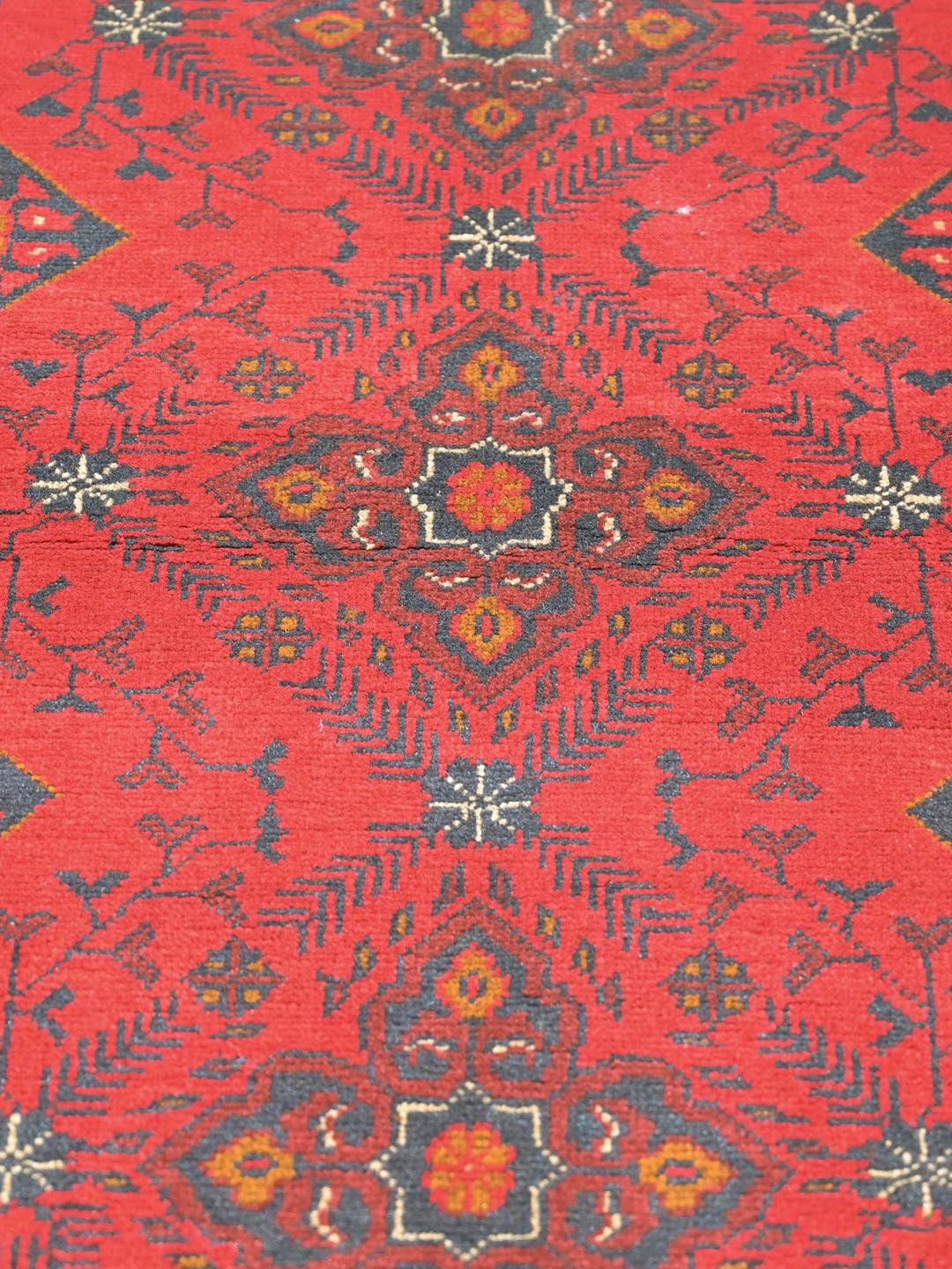 Hand-knotted Afghan Khal Mohammadi wool rug in red and black