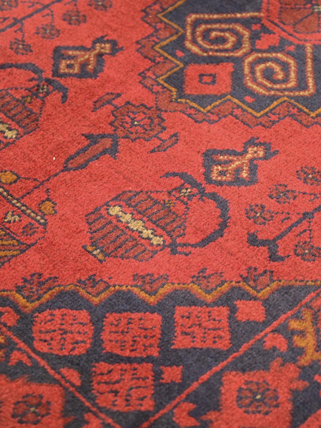 Hand-knotted Afghan Khal Mohammadi rug in red and black