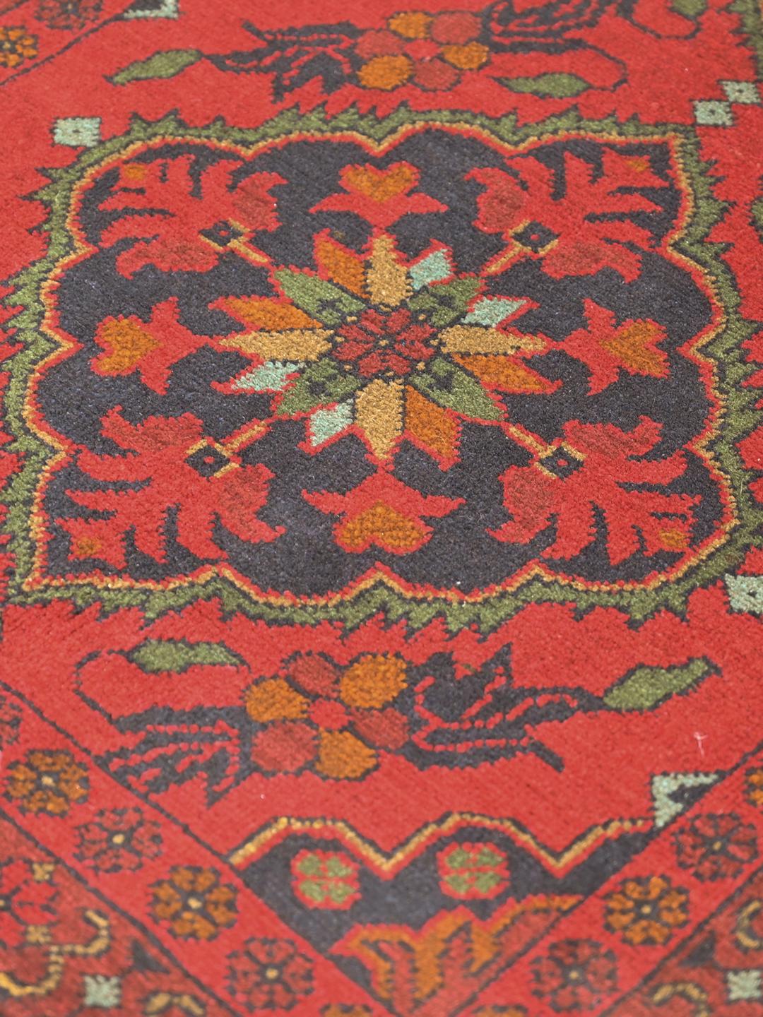 Hand-knotted Afghan Khal Mohammadi rug in red and dark blue