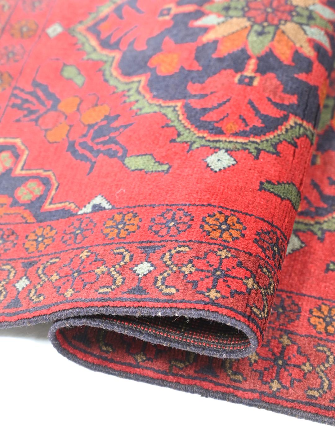 Hand-knotted Afghan Khal Mohammadi rug in red and dark blue