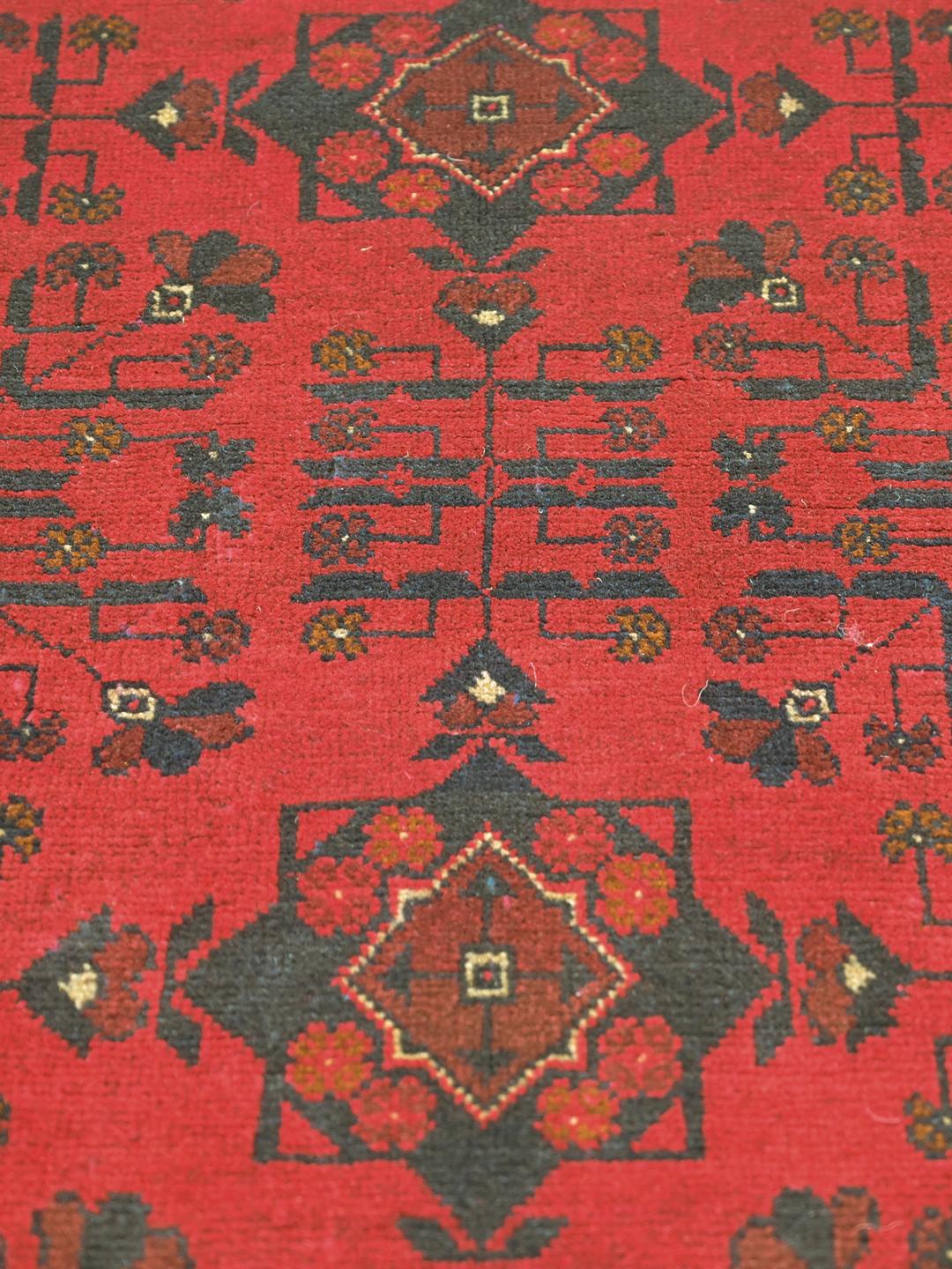 Hand-knotted Afghan Khal Mohammadi rug in red and black