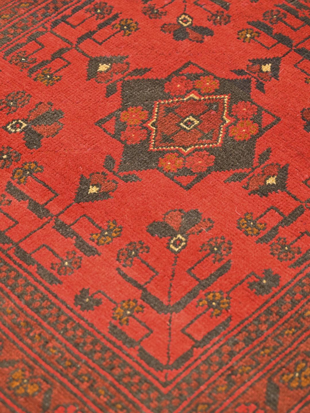 Hand-knotted Afghan Khal Mohammadi rug in red and black