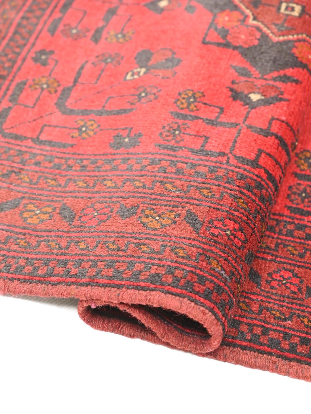Hand-knotted Afghan Khal Mohammadi rug in red and black