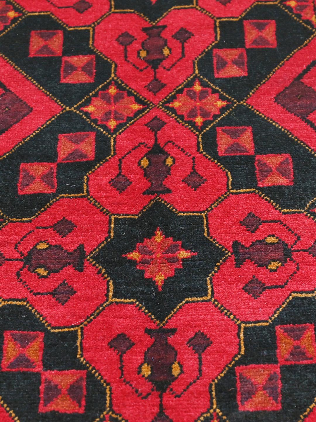 Hand-knotted Afghan Khal Mohammadi rug in red and black