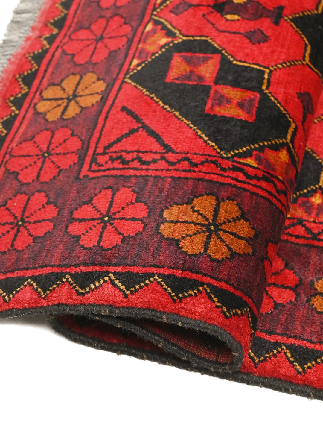 Hand-knotted Afghan Khal Mohammadi rug in red and black