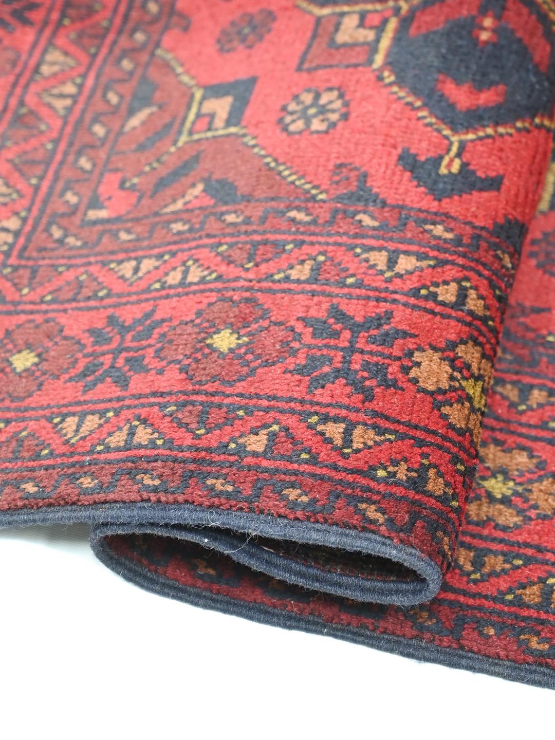 Handgeknoopt rood Afghaans Khal Mohammadi-kleed met medaillonpatronen
