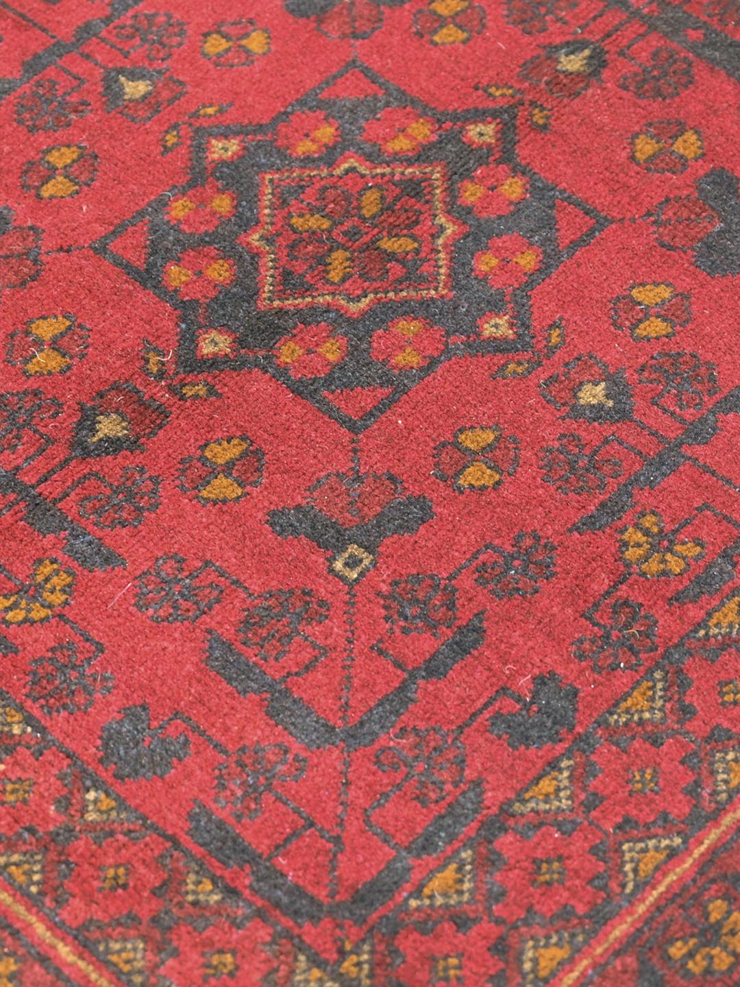 Hand-knotted red Afghan Khal Mohammadi rug with traditional medallions
