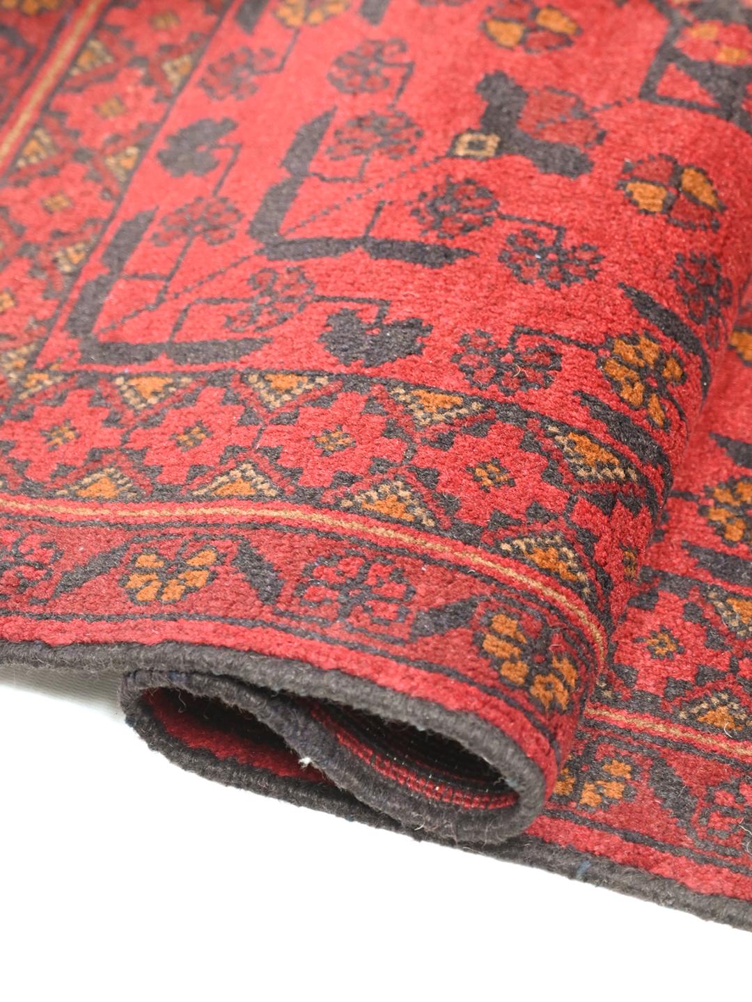 Hand-knotted red Afghan Khal Mohammadi rug with traditional medallions