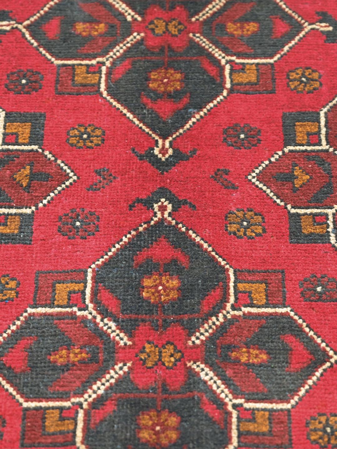 Hand-knotted red Afghan Khal Mohammadi wool rug with dark-grey medallions