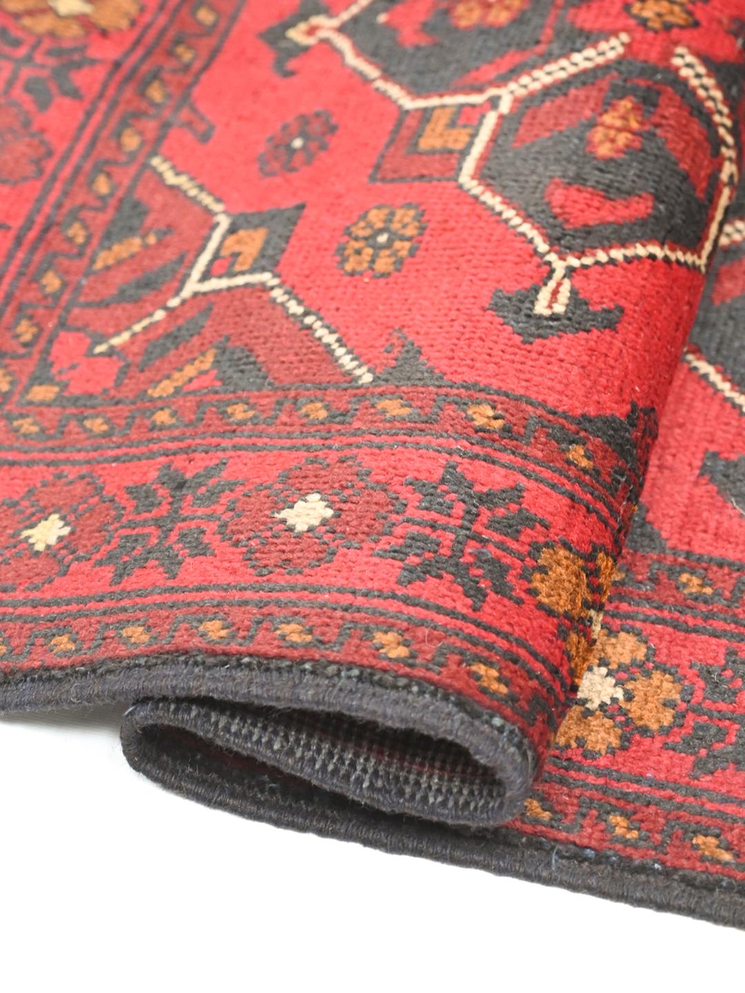 Hand-knotted red Afghan Khal Mohammadi wool rug with dark-grey medallions