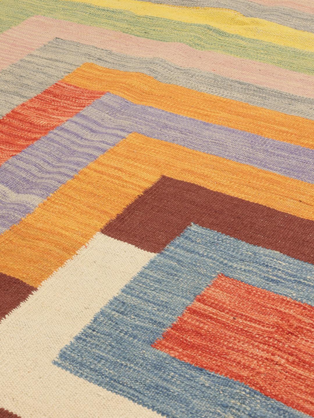 Handmade flatwoven rug from Afghanistan in multicolour with geometric pattern.