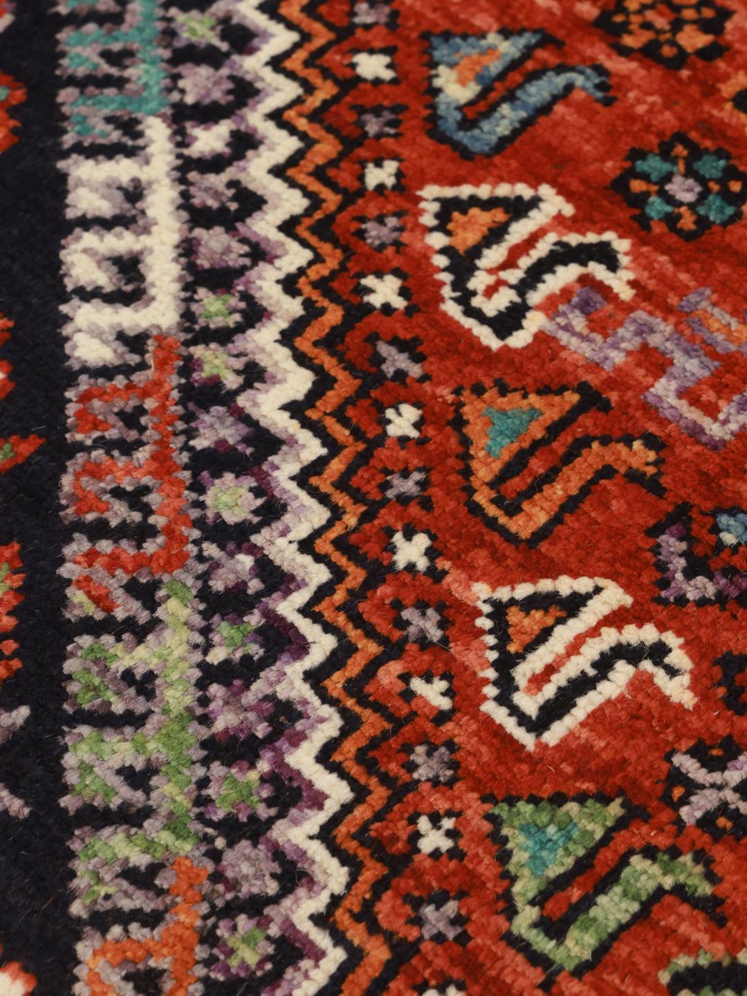 Afghan handmade wool rug in dark-red and dark-blue