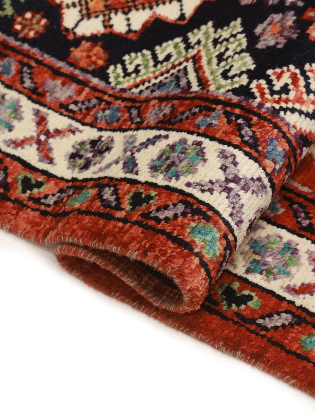 Afghan handmade wool rug in dark-red and dark-blue