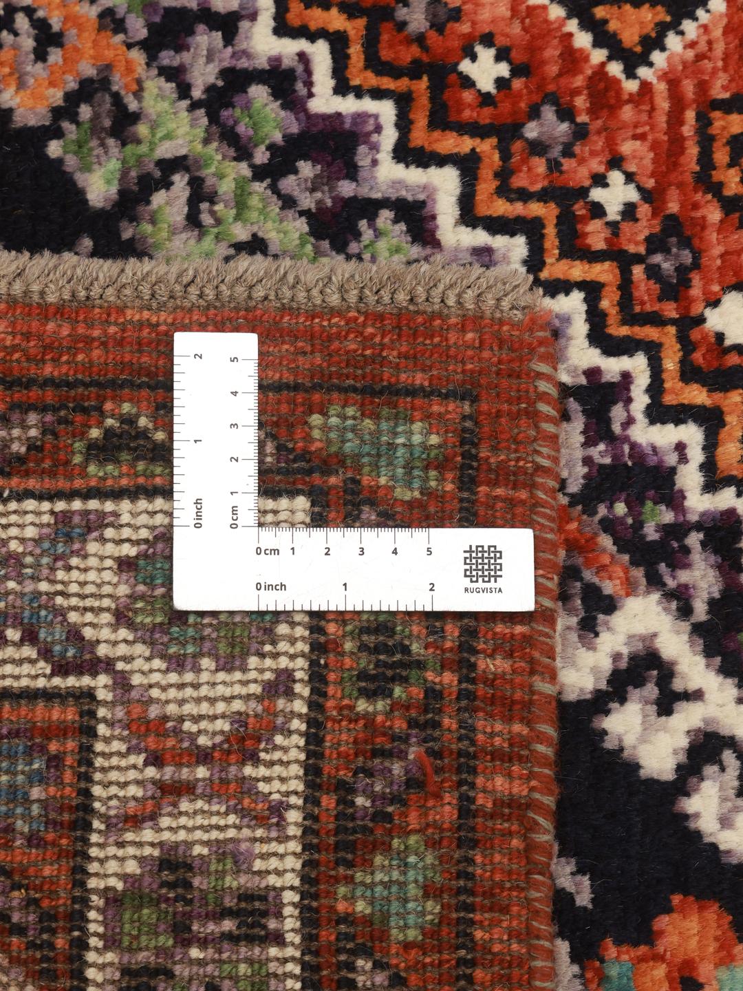 Afghan handmade wool rug in dark-red and dark-blue