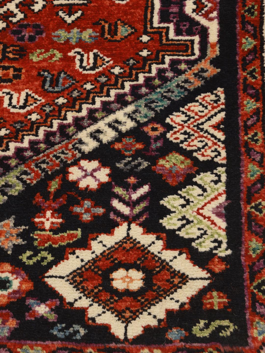 Kazak rug from Afghanistan in red and black