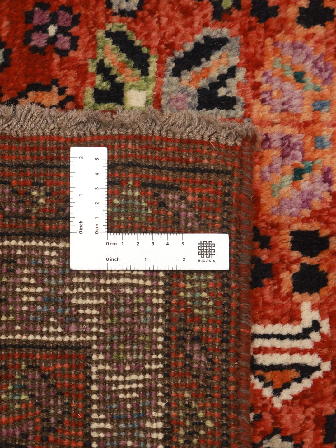 Kazak rug from Afghanistan in red and black