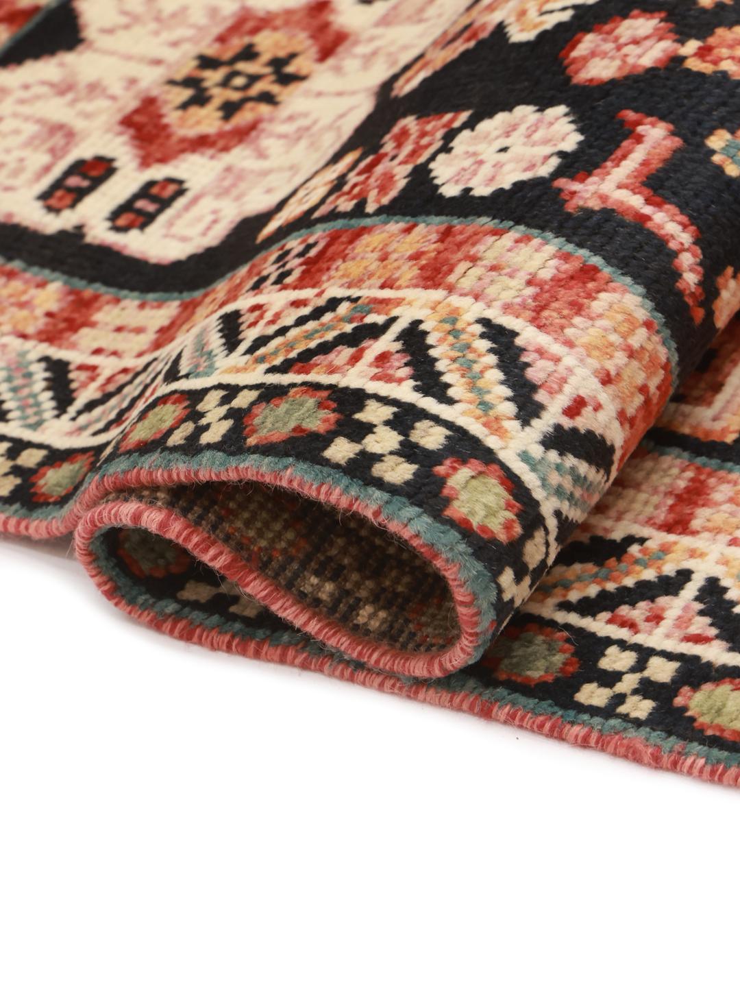 Handmade Kazak rug from Afghanistan in dark-grey and red