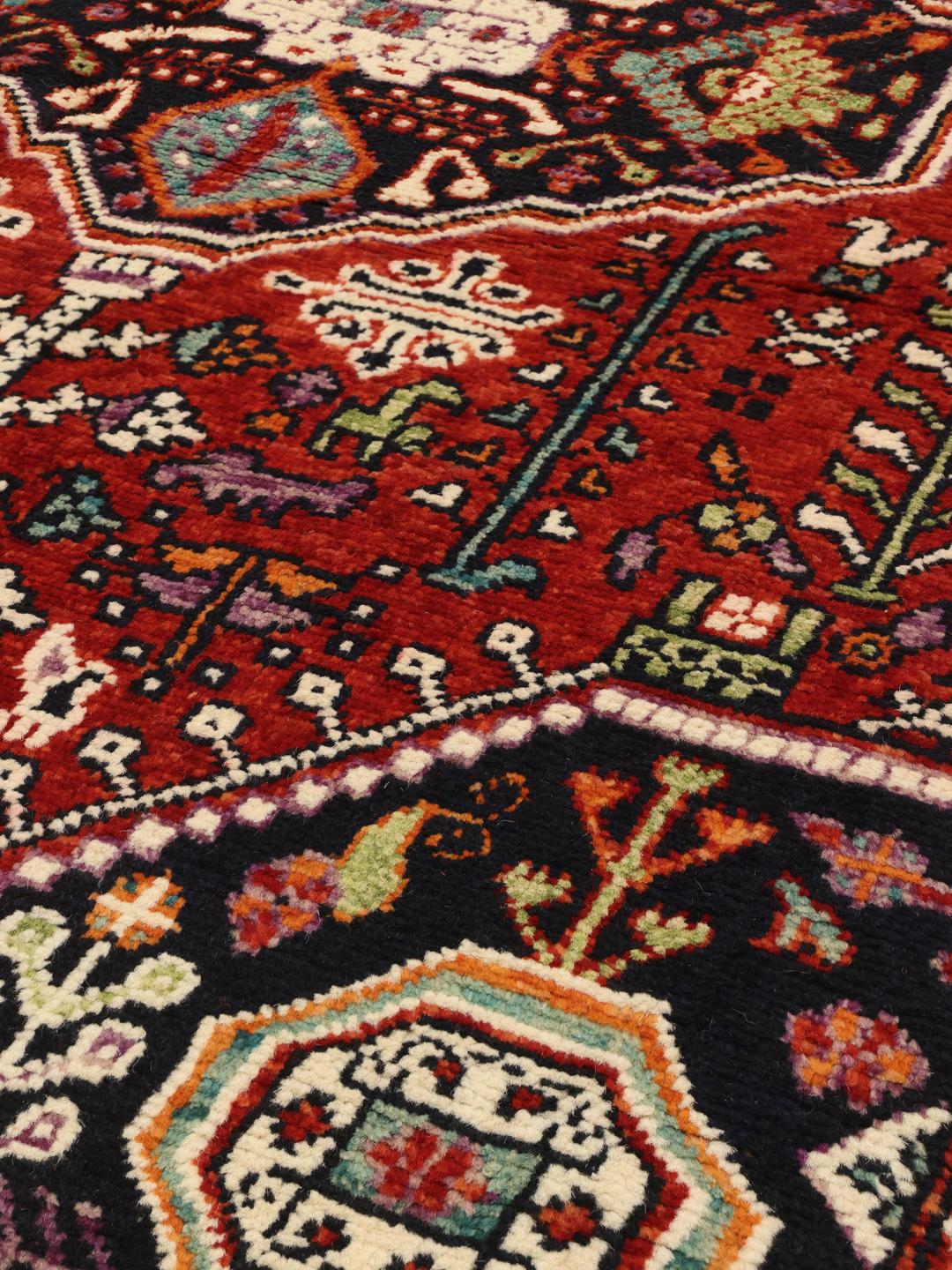 Kazak rug from Afghanistan in dark-red