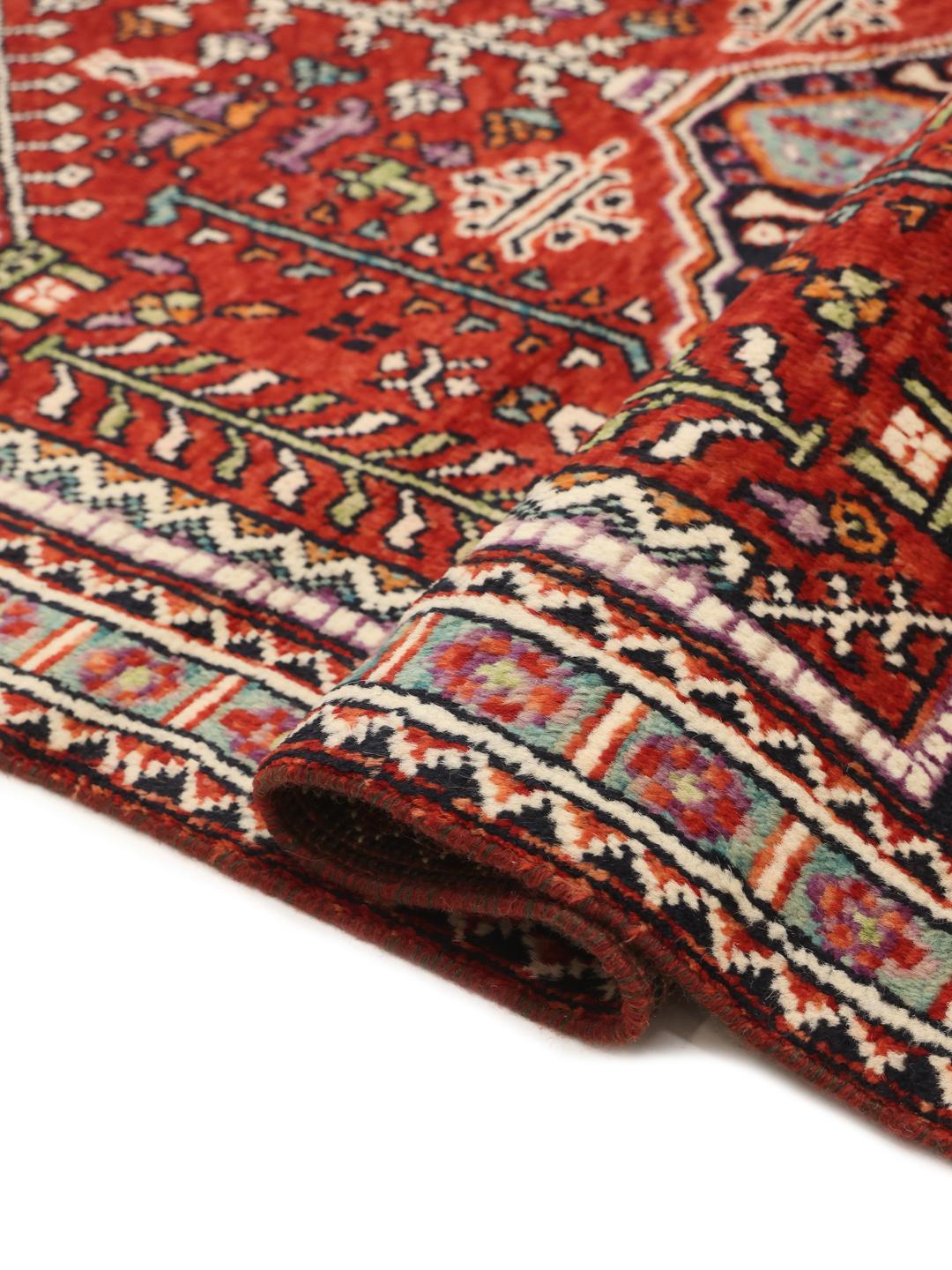 Kazak rug from Afghanistan in dark-red