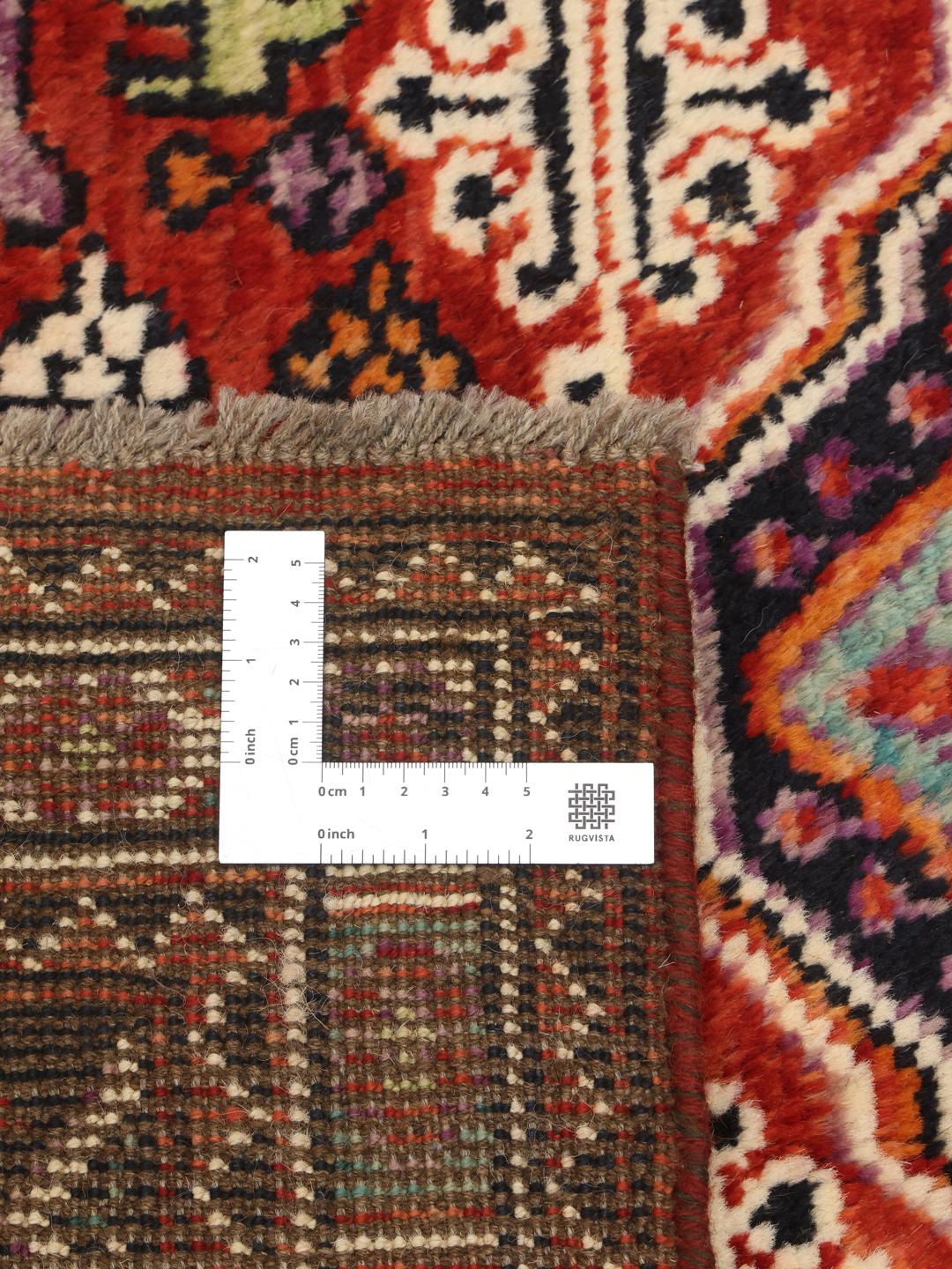 Kazak rug from Afghanistan in dark-red