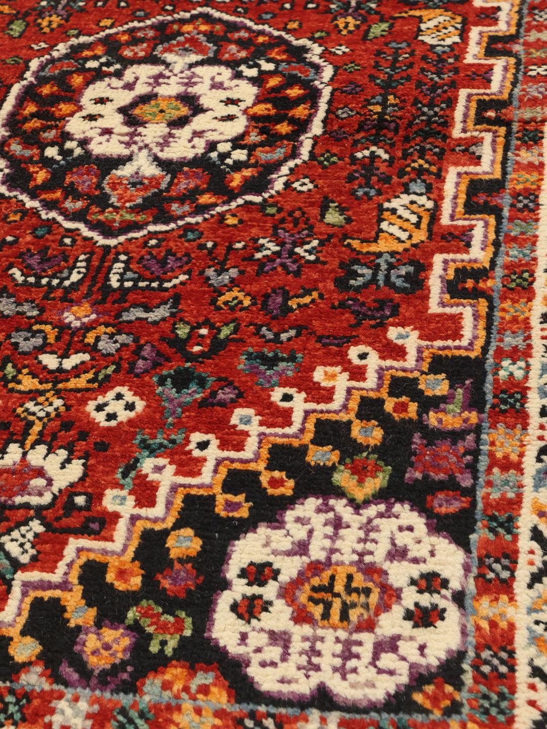 Red Afghan Kazak runner with geometric patterns