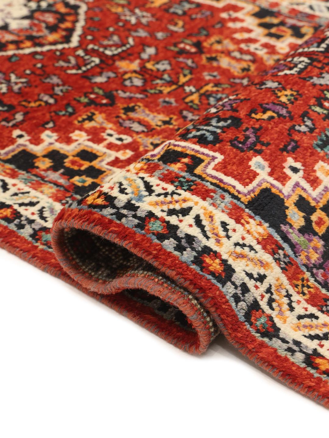 Red Afghan Kazak runner with geometric patterns