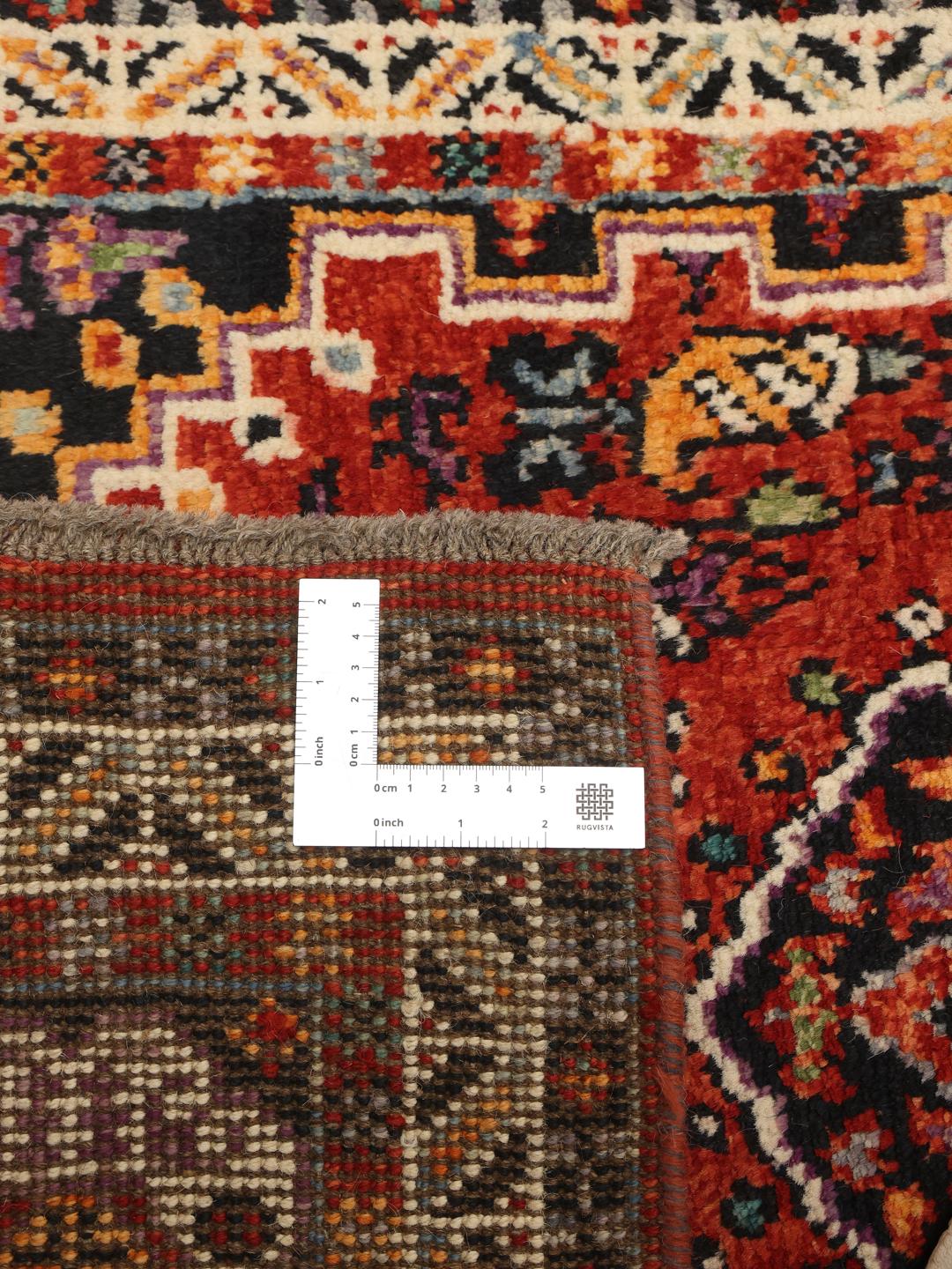 Red Afghan Kazak runner with geometric patterns