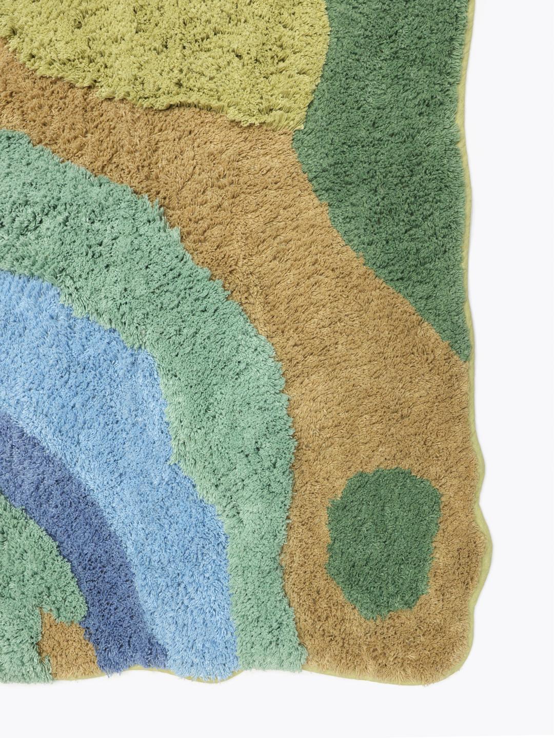 Onregelmatig gevormd katoenen kleed met een abstract blauw en groen rivierlandschapontwerp