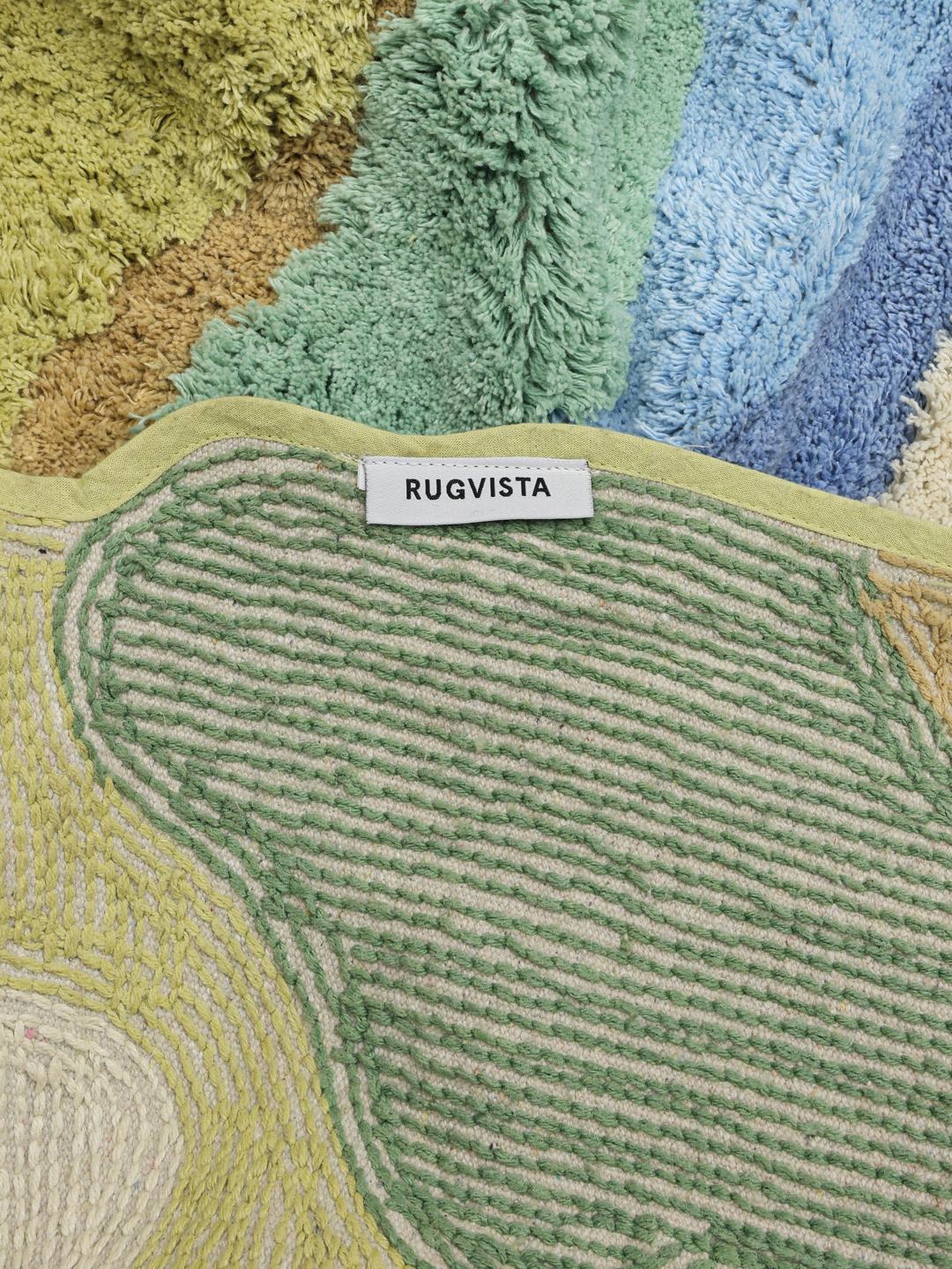Onregelmatig gevormd katoenen kleed met een abstract blauw en groen rivierlandschapontwerp